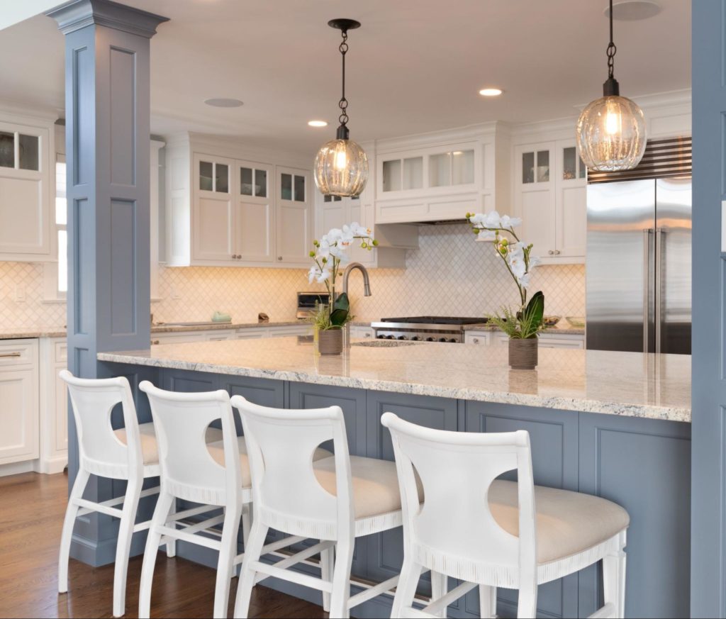 Kitchen with blue and white custom built cabinets.