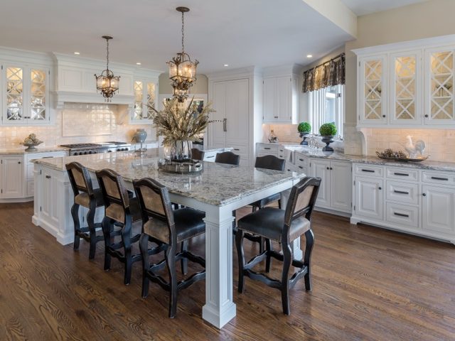 Stunning kitchen and dining space with custom built cabinets and a large custom island.